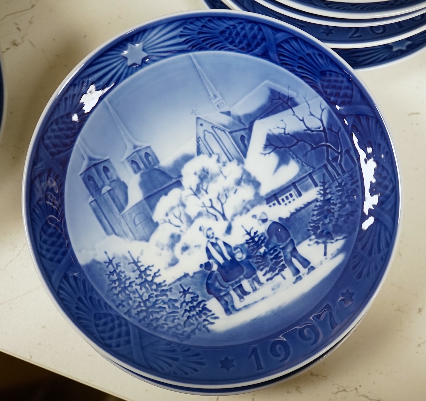 A large collection of Royal Copenhagen Christmas plates to include In the old farmyard, 1969 and In the desert 1972, with three boxes, each 18cm in diameter. Condition - good